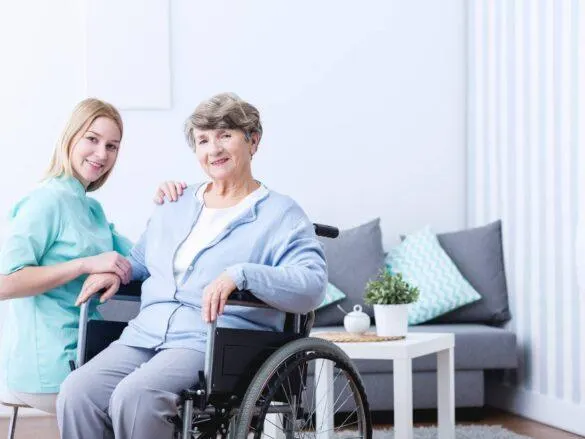 Healthcare staffing agency professional assisting a senior with daily living skills