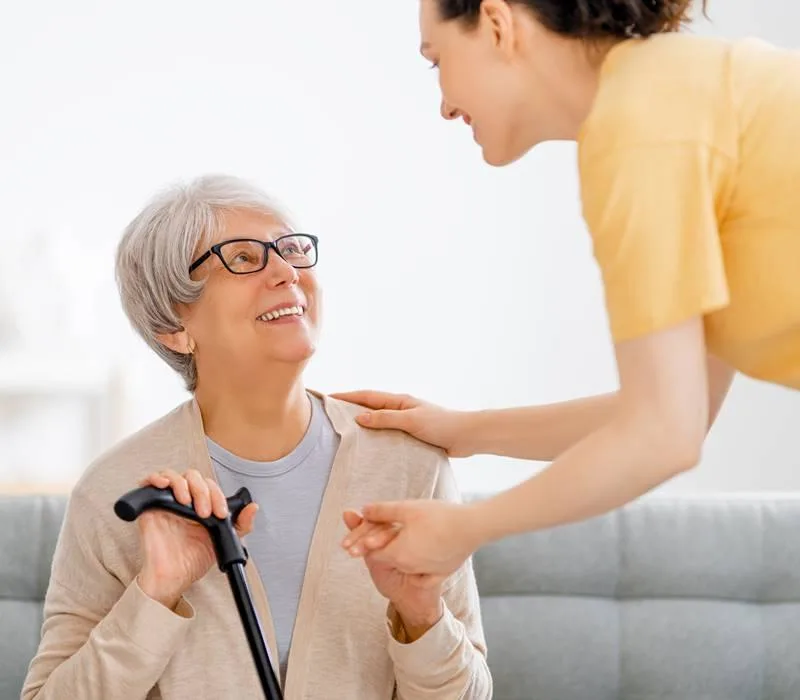 Support Workers UK assist elderly person in a home-based support .