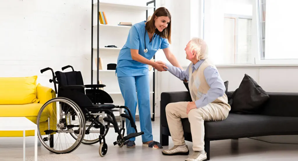 Agency care worker in London assisting elderly client in supported living